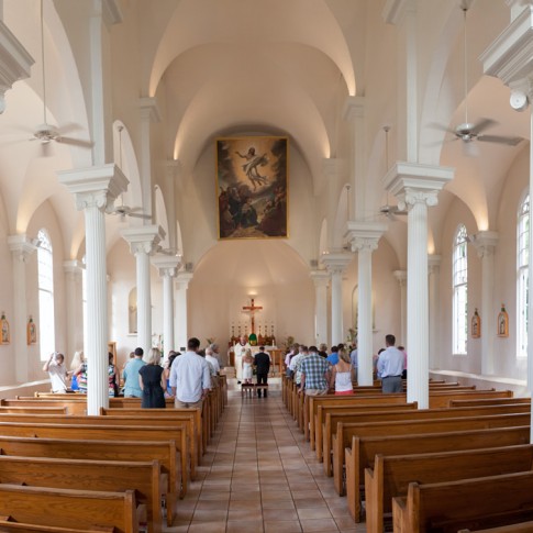A picture of a Catholic wedding ceremony at Maria Lanakila Church in Lahaina, Maui.