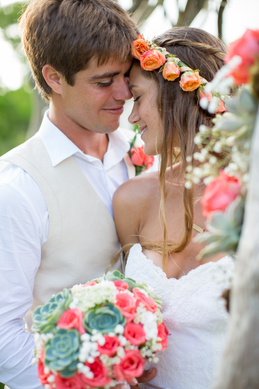 Couple in a tender moment with tropical flowers