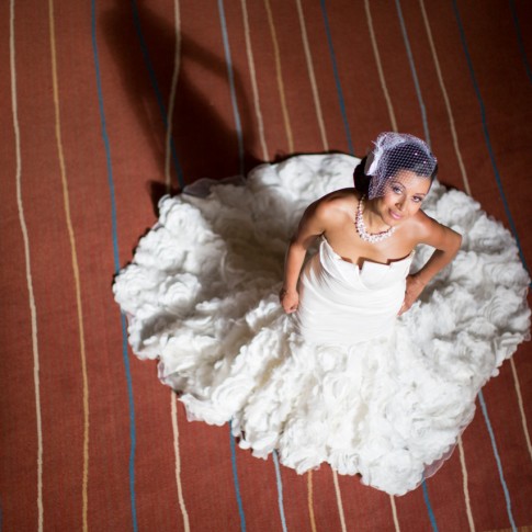 Photograph looking down at a bride in her wedding dress